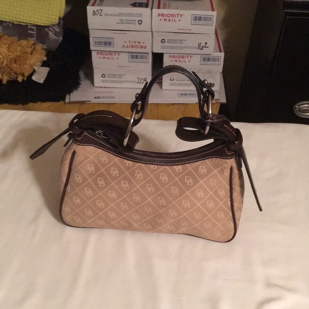 Dooney Bourke cream and Brown shoulder bag .